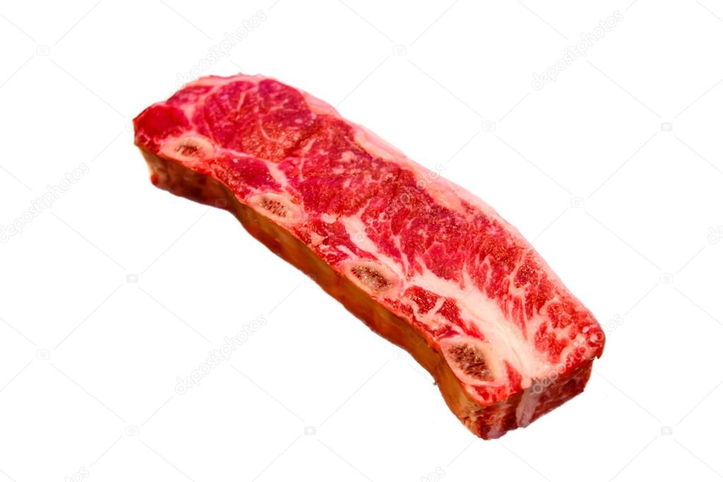 Beef steak Kalbi/Flanken Style Ribs lies on a white background. 