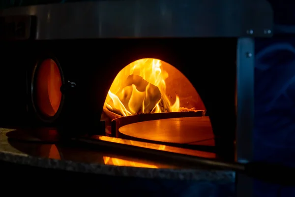 Burning fire in the pizza oven