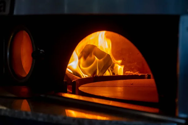 Burning fire in the pizza oven