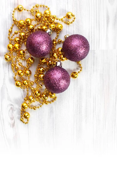 Gold beads and purple toys — Stock Photo, Image