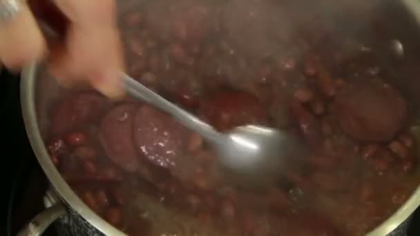 Cooking a bean soup with bacon — Stock Video