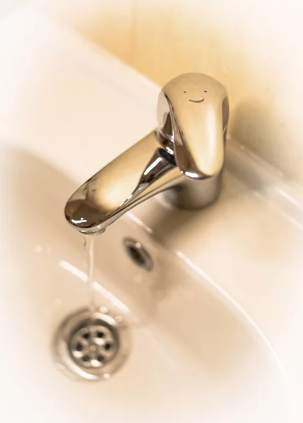 Funny faucet (sepia) — Stock Photo, Image