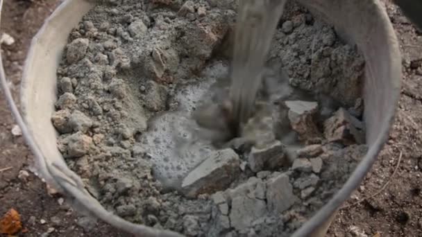 Builder Mixing Cement Bucket Worker Mixing Cement Construction Concept — Stock Video