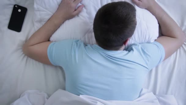 Young Man Waked Looks Phone Return Sleep Again Alarm Clock — Stock Video