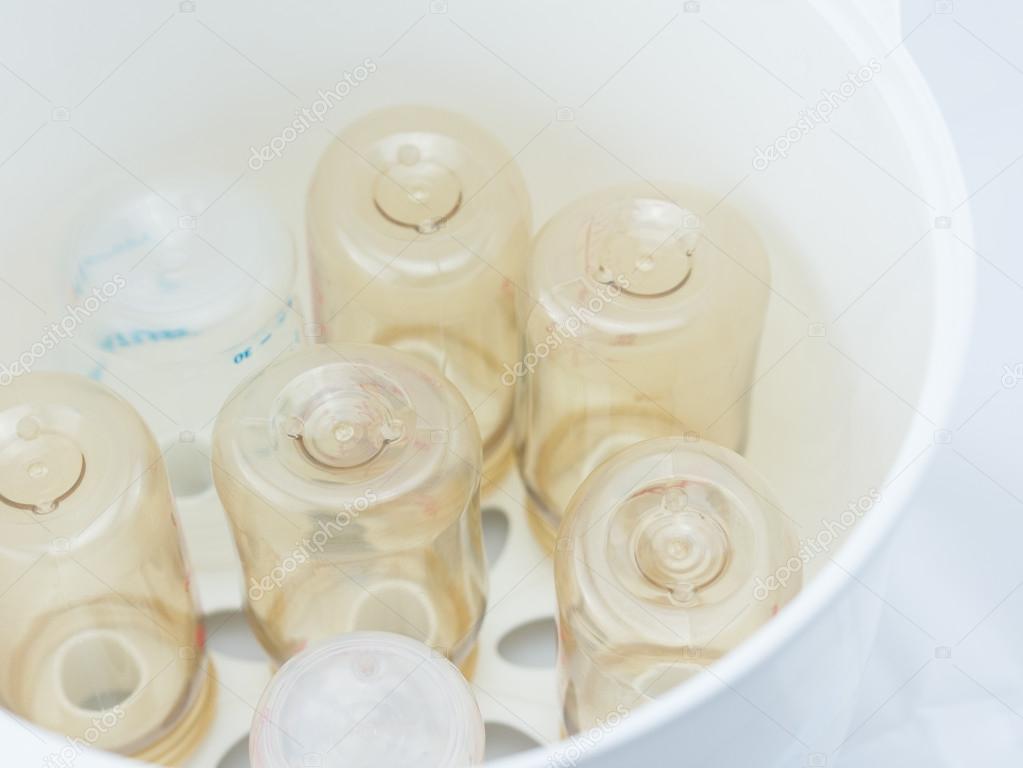 Milk bottles in steam sterilizer.