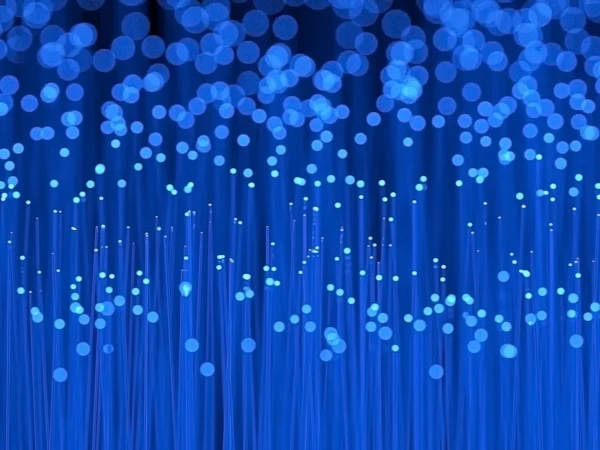 Fiber optic cables close up with blurry bokeh effect. 3D rendering. — Stock Photo, Image
