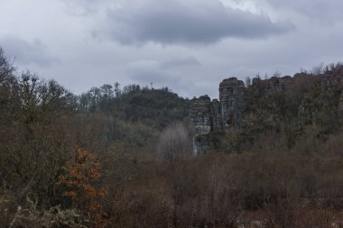 Rock formation at the impressive Vikos gorge in the Zagoria region at Pindus Mountains on a dark winter day with atmospheric mood, Epirus, Greece