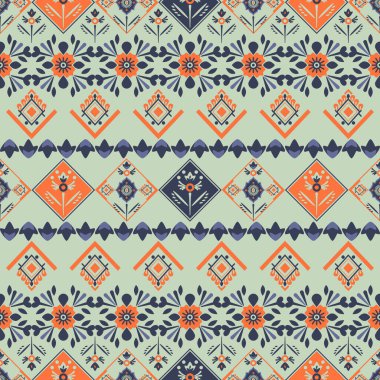 Geleneksel Filistin nakış tarzı turuncu çiçekler ve yeşil arka planda geometrik şekiller içeren pürüzsüz desen