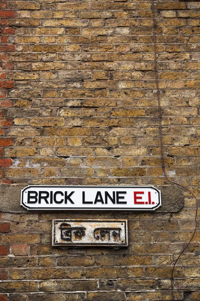 Brick Lane muur teken — Stockfoto