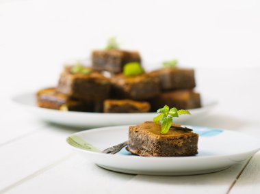 Chocolate  brownie on the white vintage table.