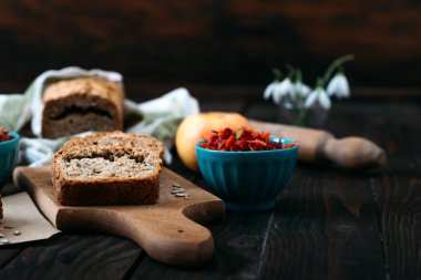 Homemade integral bread and vitamin salad on the rustic table.