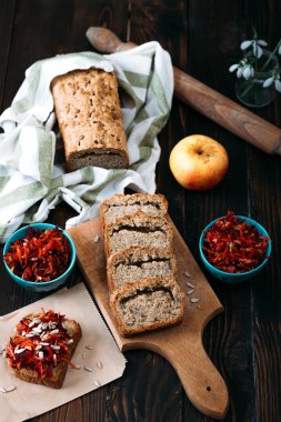 Homemade integral bread and vitamin salad on the rustic table.