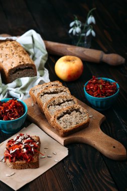 Homemade integral bread and vitamin salad on the rustic table.