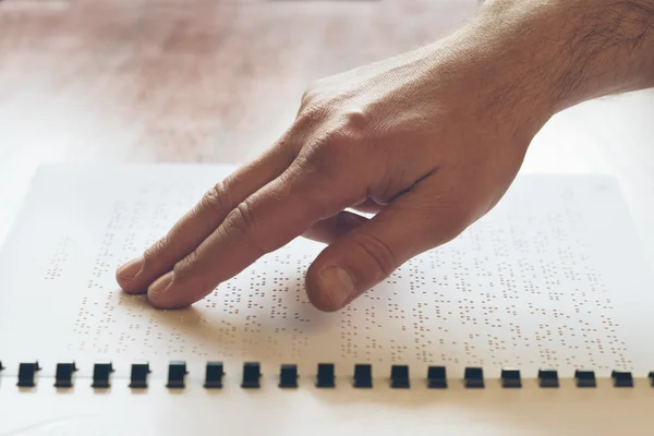 Visually impaired old person learning to reading by touch — Stock Photo, Image