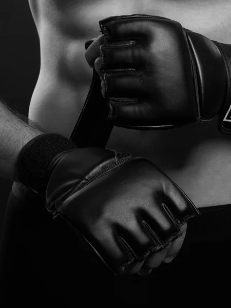 Mma fighter putting gloves. — Stock Photo, Image