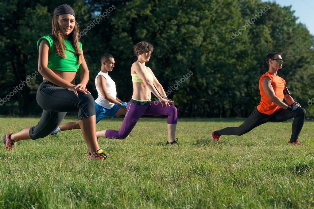 Small Group Of Athletic People Exercising In A Gym Stock Photo - Download  Image Now - iStock