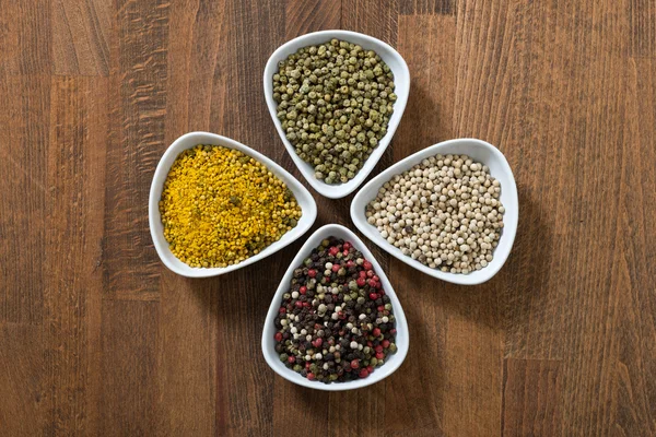 Different colorful spices on the wooden table. — Stock Photo, Image