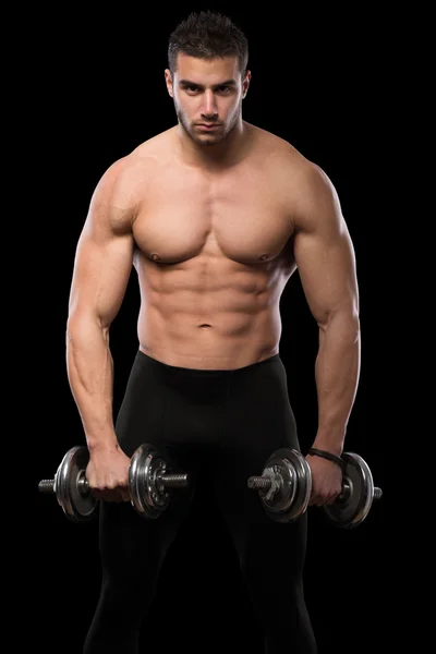 Muscular men exercise with dumbbells. Stock Picture