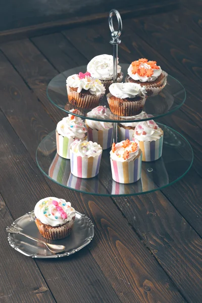 Cup cake on rustic table.