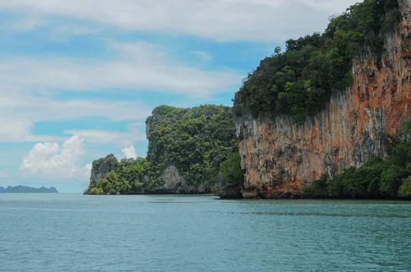 The Ochre Colours of the Rock Glow in Reds and Browns. Islands at Phang Nga Bay near Krabi and Phuket. Thailand.