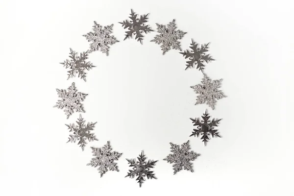 Silver Christmas ornament snowflake on white background top view. Christmas and Holidays greeting card, frame — Stock Photo, Image