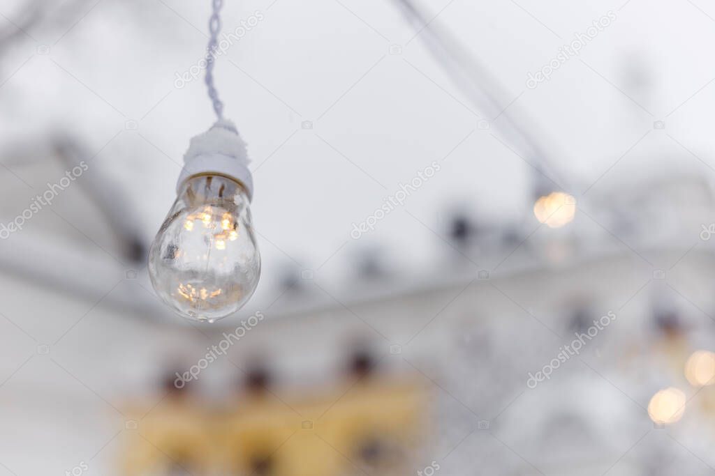 Lighting decor. Retro light bulb filament close up. Illuminated.