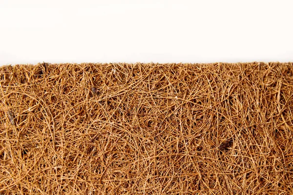 Colchón de cerca hecho de fibra de coco aislada sobre blanco. — Foto de Stock