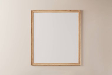 Pastel boyalı duvarda beyaz arka planı olan ahşap çerçeve.