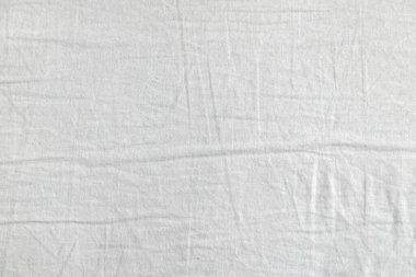 Beyaz kumaş dokusu. Kıyafet arka planı. Kapat.