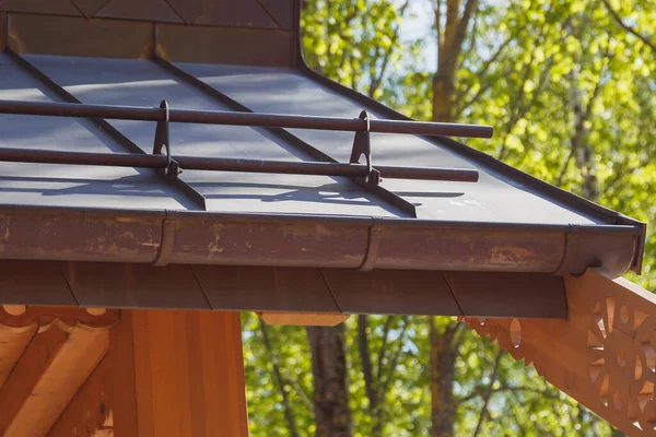 Close up view of fastening metal snow retainer on copper roof — Stock Photo, Image