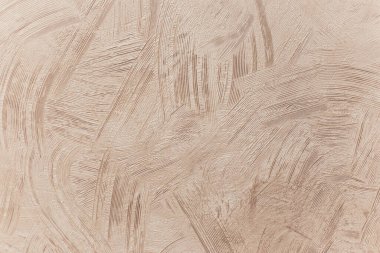 Duvarda fırçayla yapılmış dekoratif alçı efekti