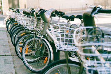 city classic bicycle with basket stay at parking