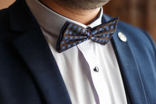 Groom in blue suit style butterfly on neck — Stock Photo, Image