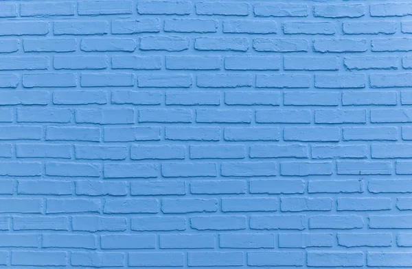 Light blue painted brick wall