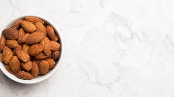 Top View Stop Motion Animation Almonds Nuts White Bowl — Αρχείο Βίντεο