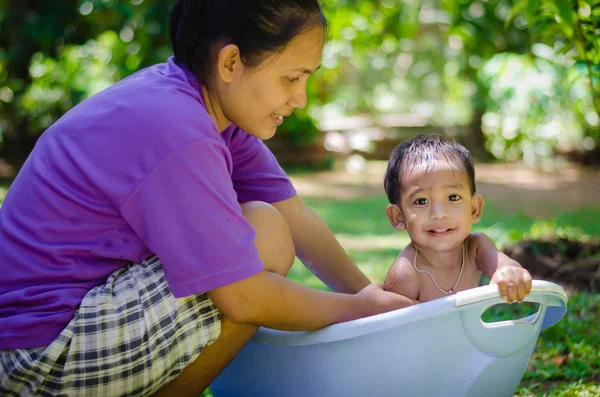 Asian Child Bathing Outdoor with His Mother. — Stock Photo, Image