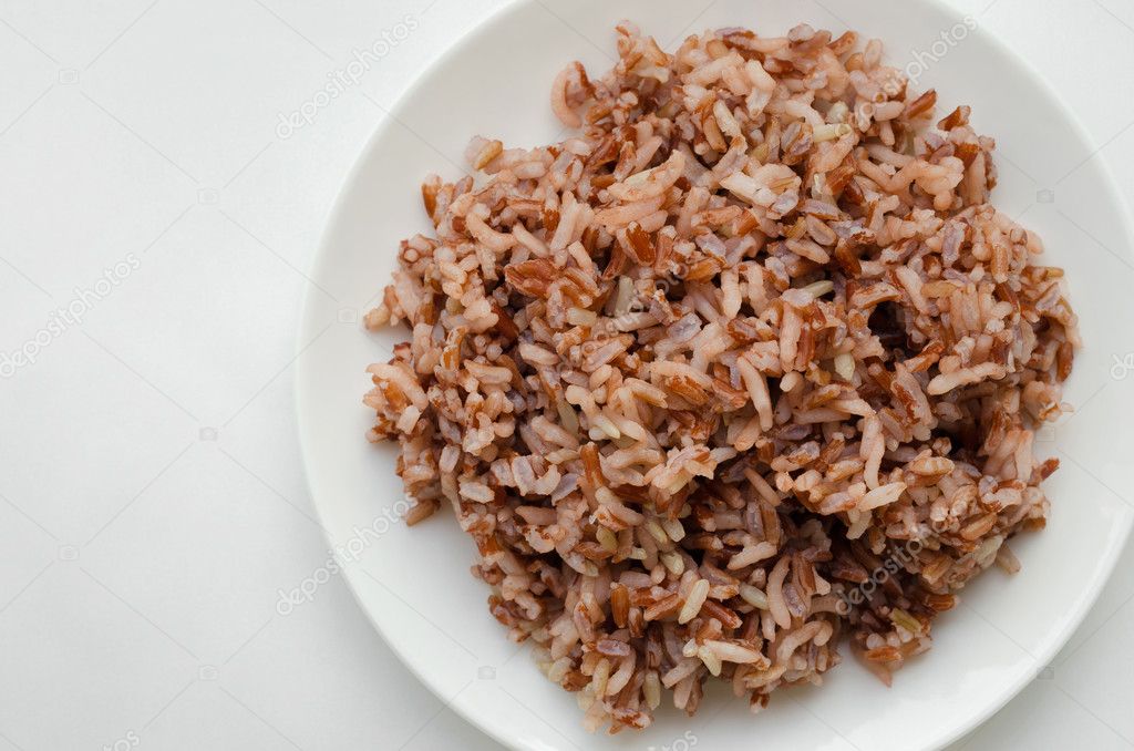 Brown Rice On White Plate.