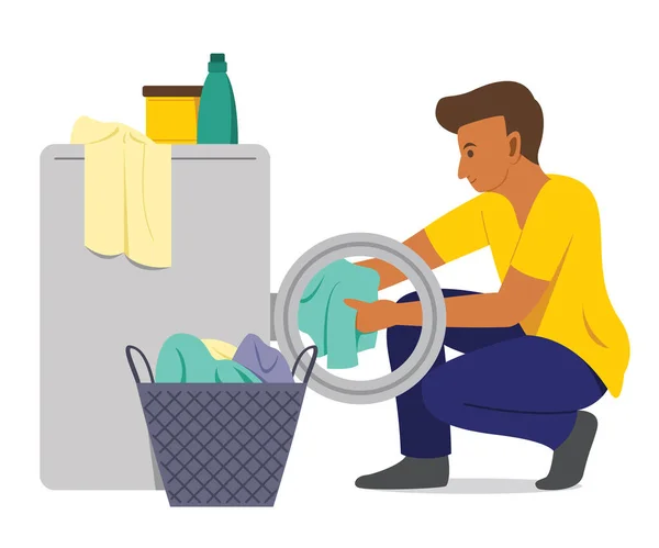 Adam Çamaşır Makinesiyle Çamaşırları Yıkar.