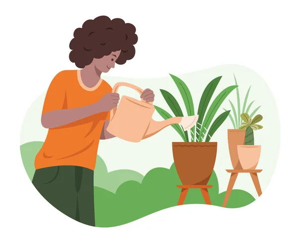 İnsan, bahçedeki bitkileri suluyor..