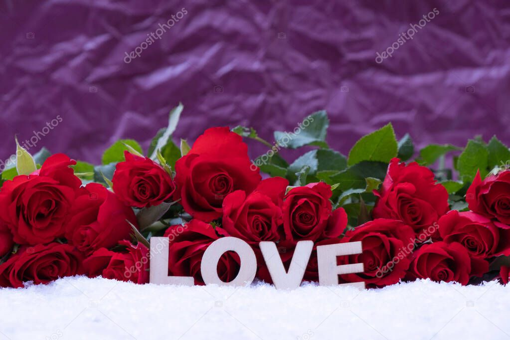 a bouquet of red roses and the inscription 