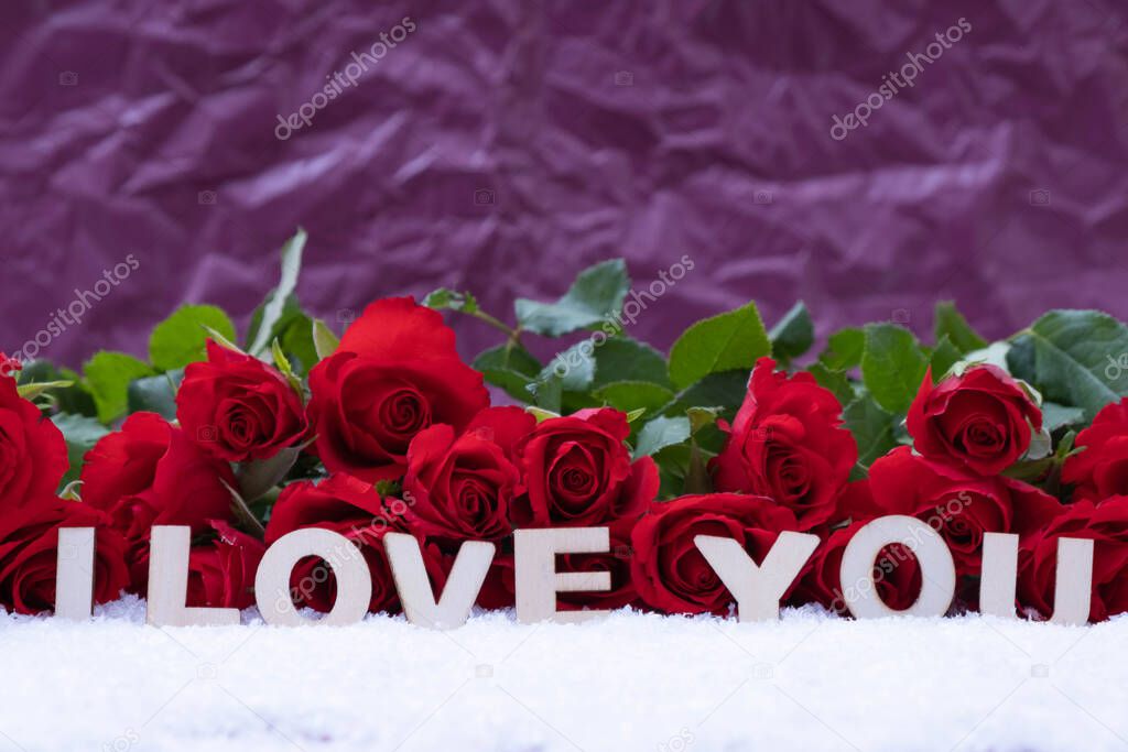 a bouquet of red roses and the inscription 