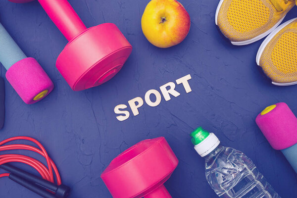 sports equipment lies on a blue, textured background, close-up