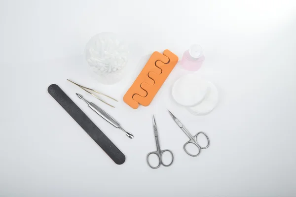 Uma variedade de ferramentas para manicure. os cuidados com as unhas . — Fotografia de Stock