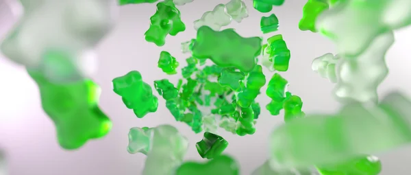 Transparente verde doce goma ursos caindo fundo — Fotografia de Stock