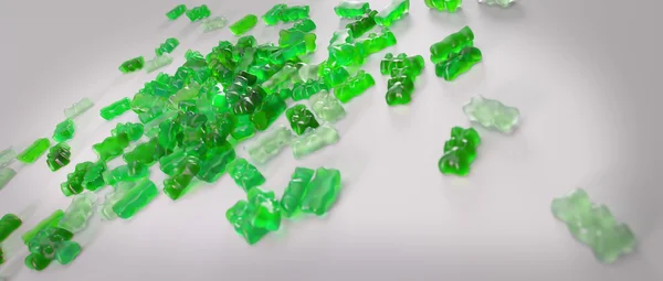 Transparent green sweet gummy bears laying background — Stock Photo, Image