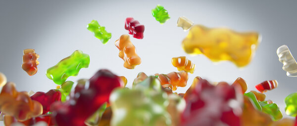 Transparent colorful sweet gummy bears falling background