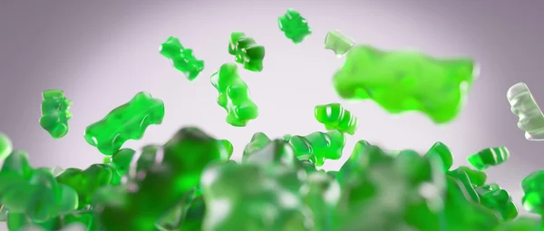 Transparent green sweet gummy bears falling background — Stock Photo, Image