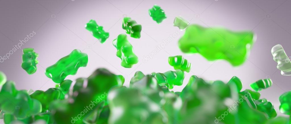 Transparent green sweet gummy bears falling background