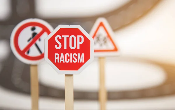 red stop sign. no racism, stop discrimination based on race religion gender . Promotion of equal rights and equal opportunities