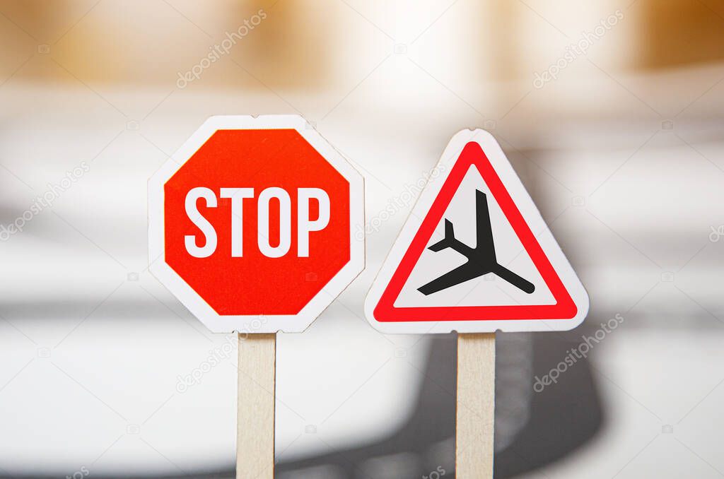 road sign - caution low-flying aircraft. Stopping flights during the coronavirus pandemic